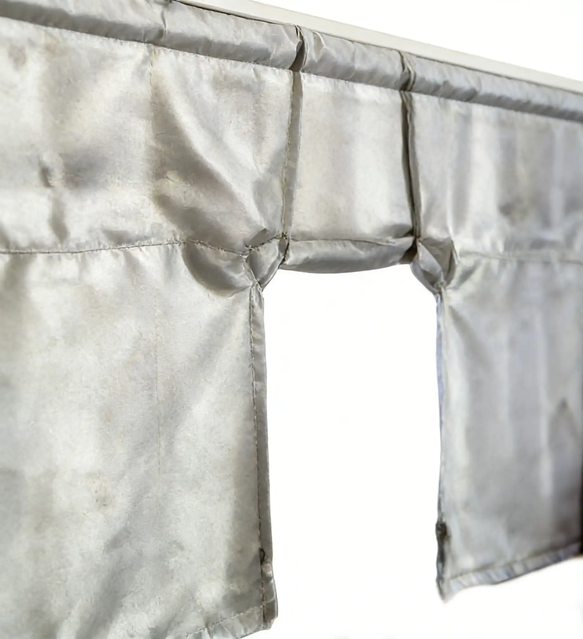 Custom high-temperature heat shield and thermal barrier curtains protecting industrial work areas